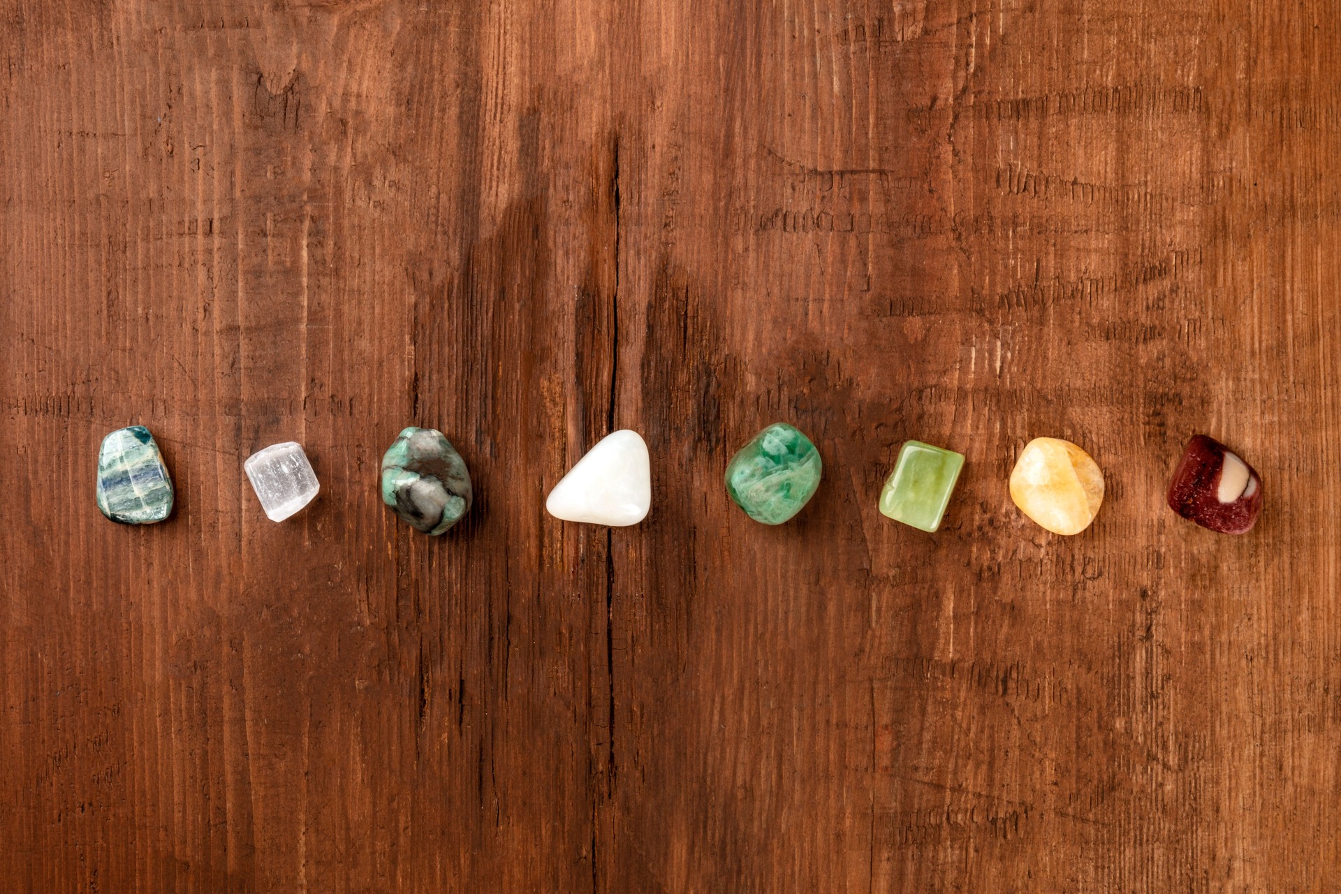 An overhead photo of gemstones, healing stones with a place for text