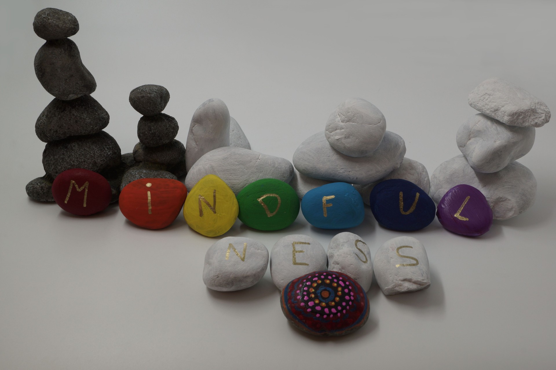 Concept Mindfulness - Balancing stones combined with colored stones